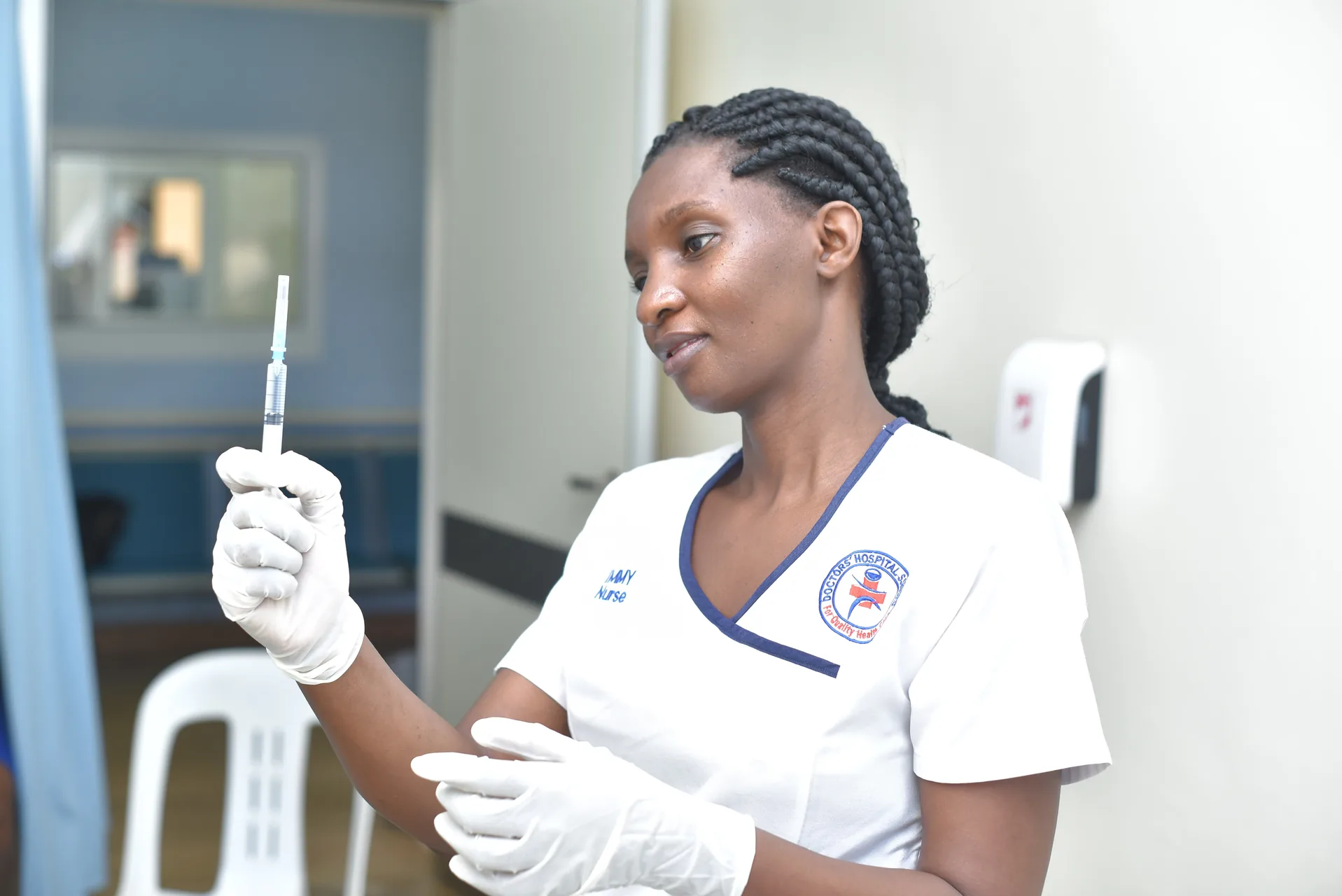 A nurse preparing vaccination care